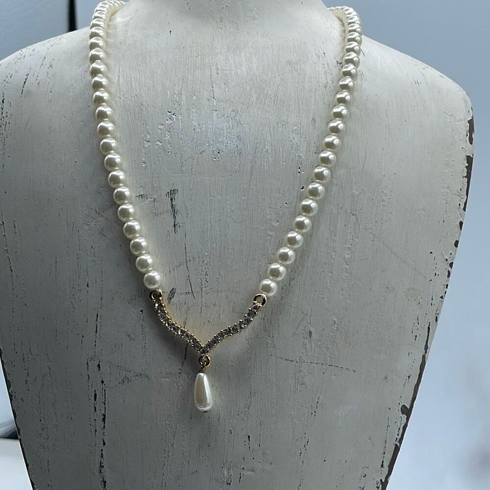 Vintage simulated pearl necklace with a chevron pendant rhinestones.